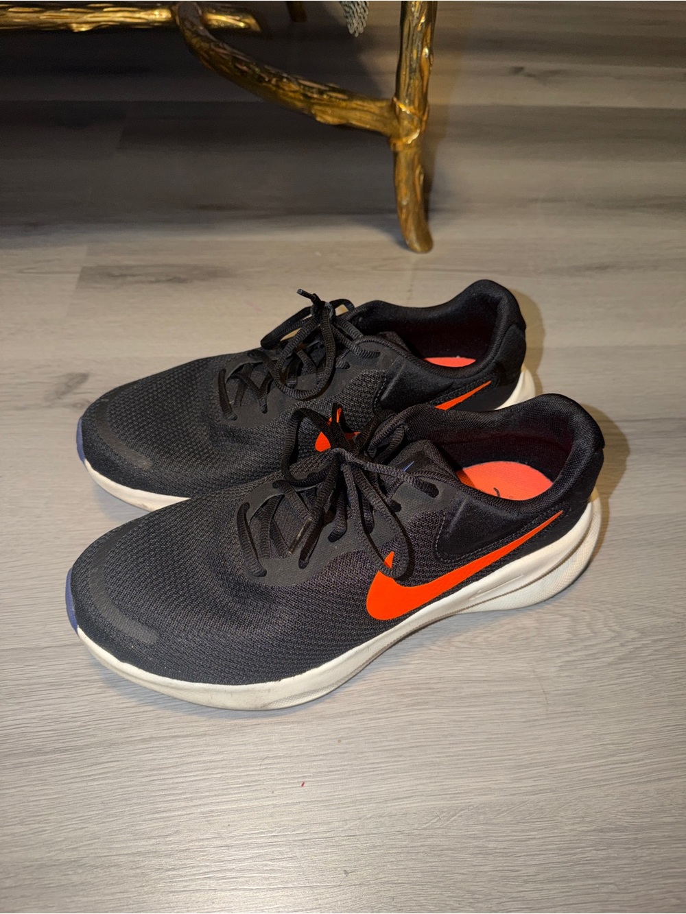 Nike Men’s Black Athletic Shoes with Orange Swoosh